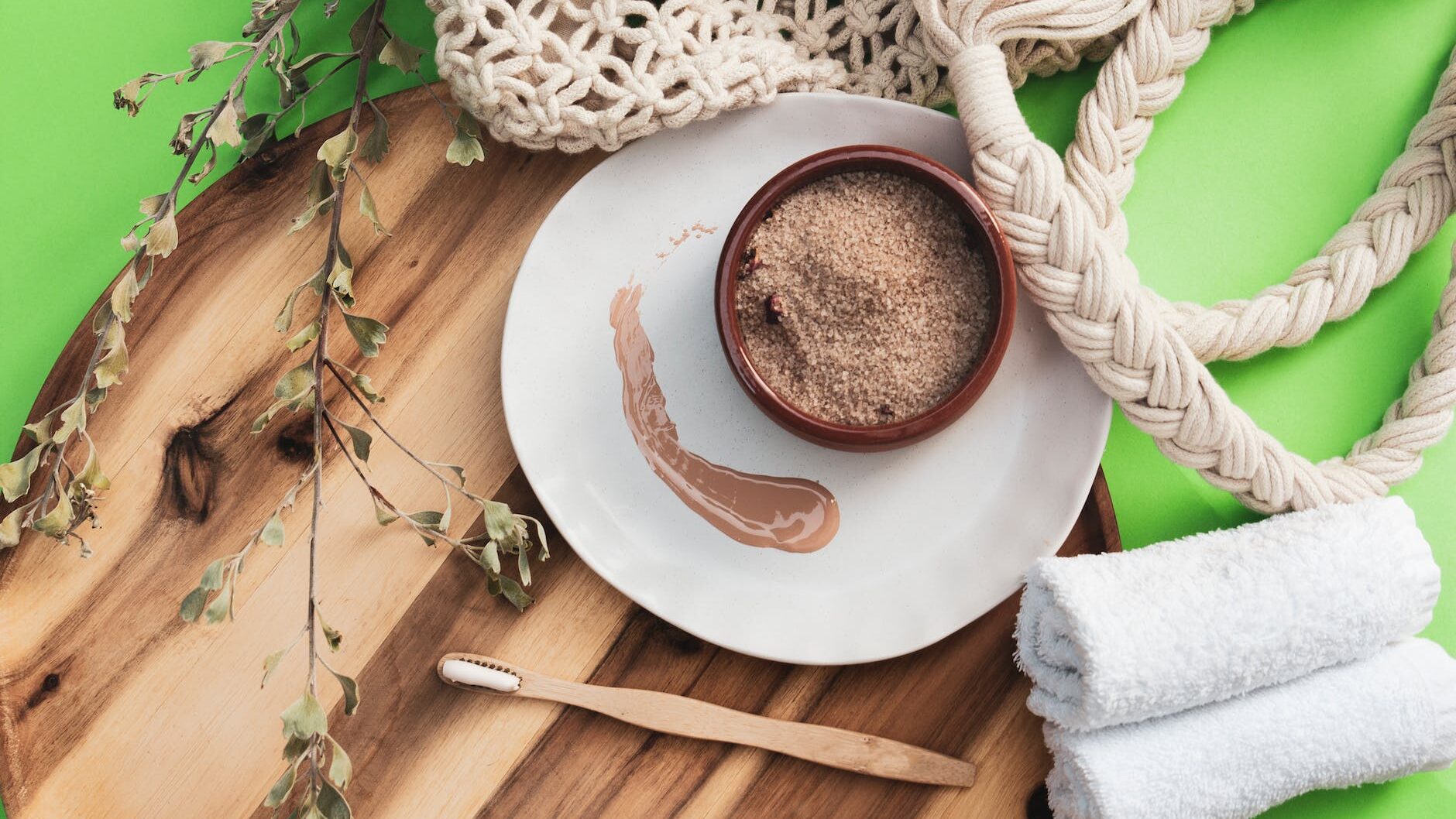 rolled towels and a wooden toothbrush